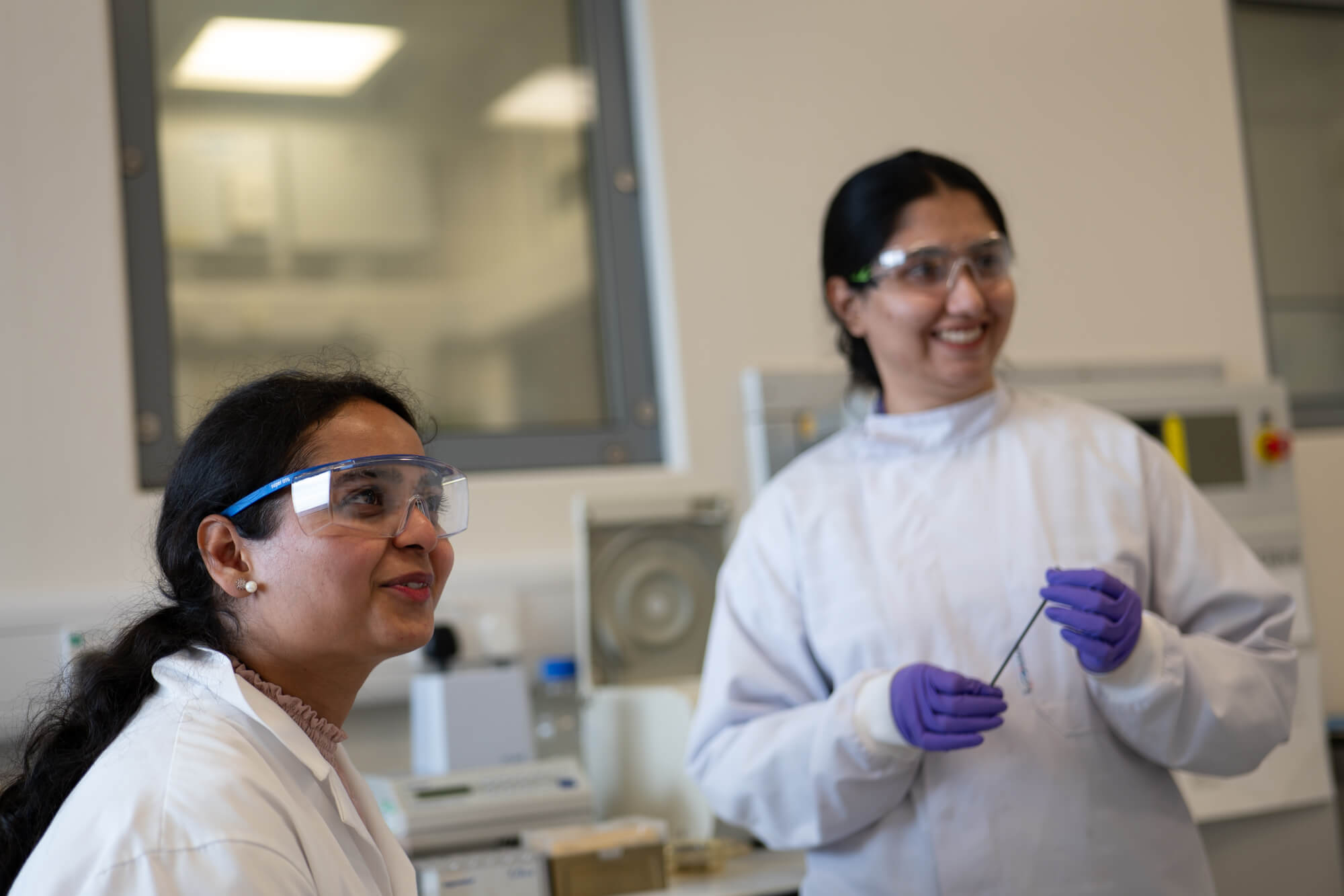 Diverse scientists in laboratory research setting showcasing STEM leadership